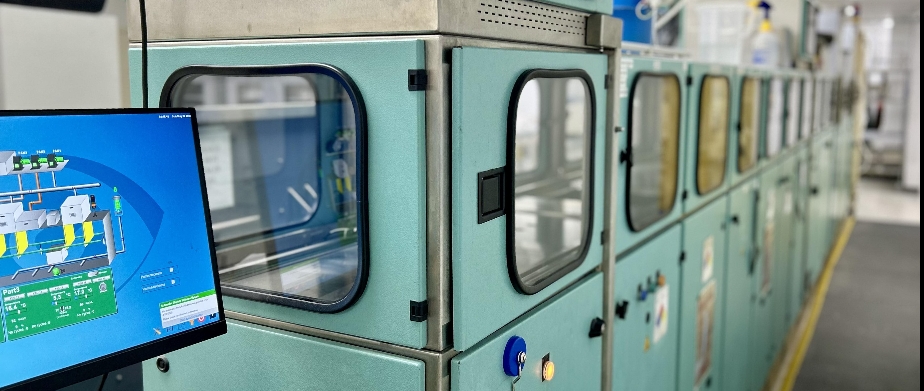 picture of lab tech at no-glare machine